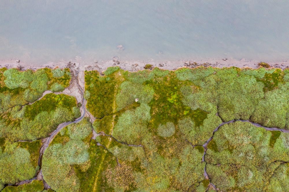 shot from the air next to river