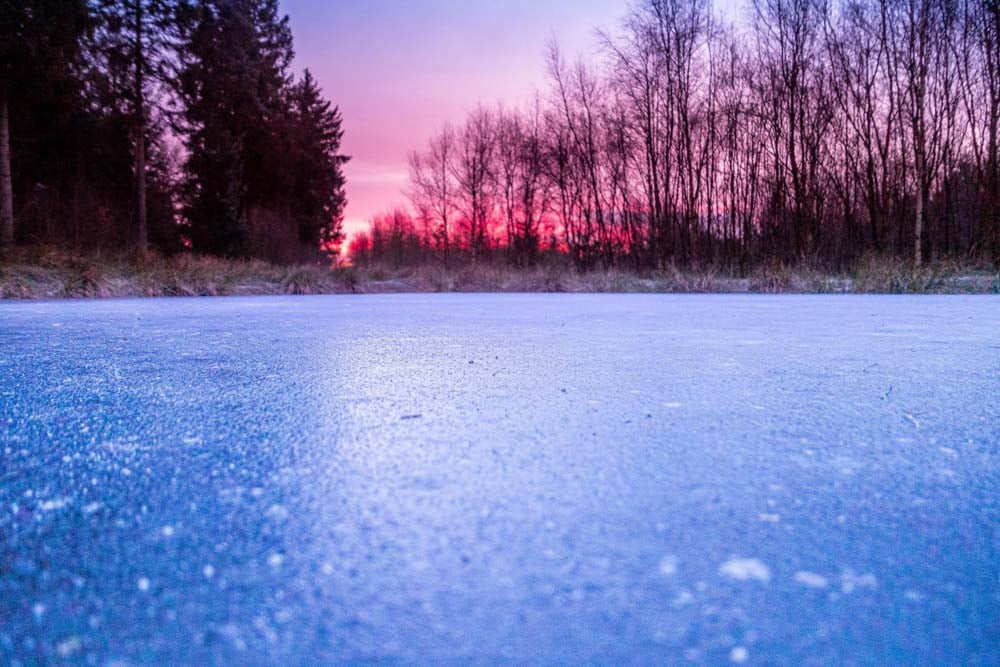 icy pond at sunrise