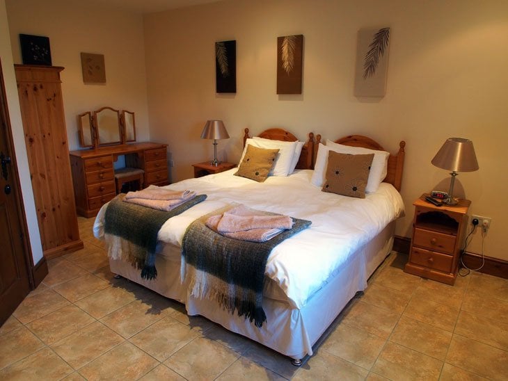 bed in the lovely room at Cumberwell country cottages