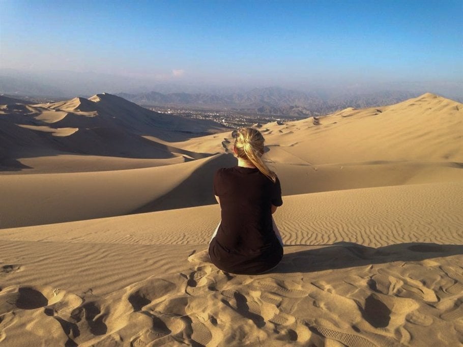 sat on the sand dune in peru