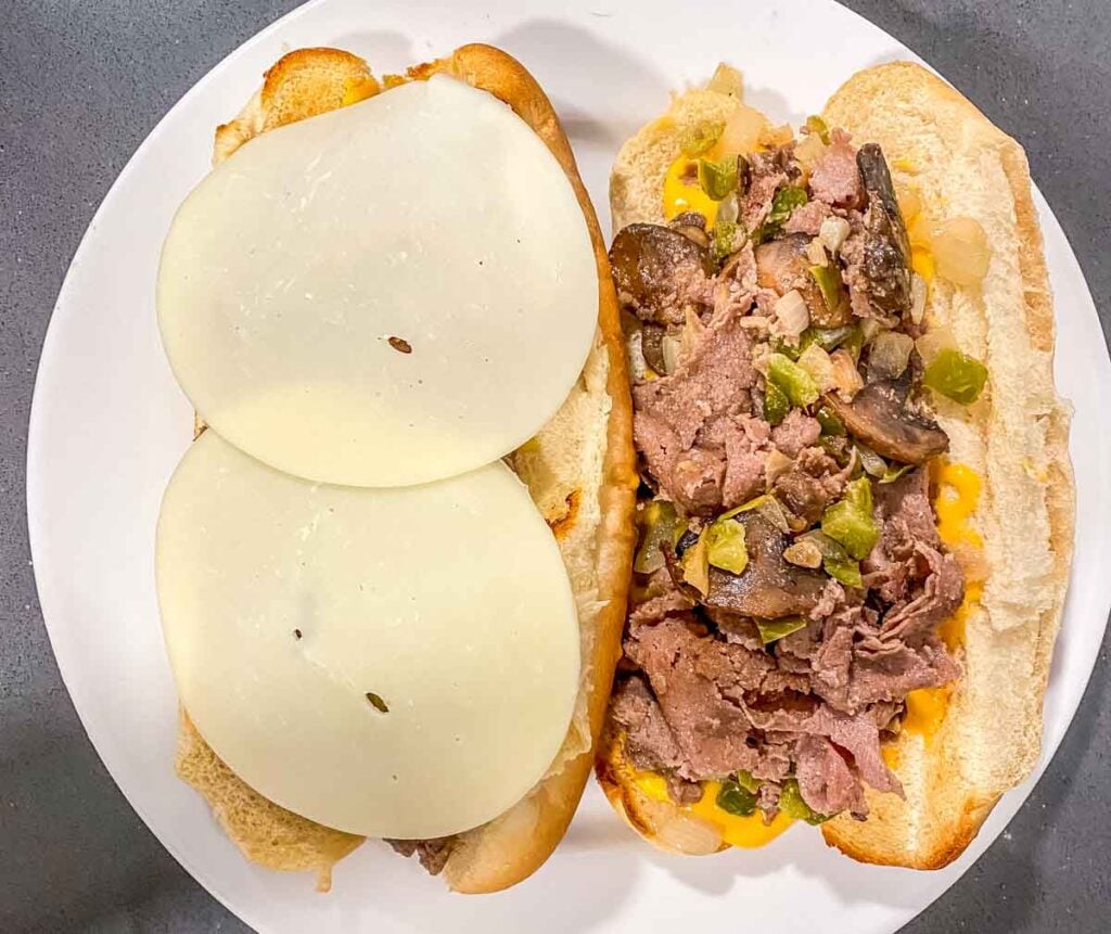 philly cheesesteak on a roll, sandwich